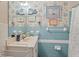 Bathroom with blue tile, vanity, and shower at 7313 S Obrien St, Tampa, FL 33616