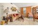 Living room with couch, chair, and vintage decor at 7313 S Obrien St, Tampa, FL 33616