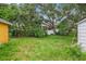 Large backyard with mature trees and a shed at 7313 S Obrien St, Tampa, FL 33616