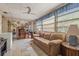 Sunroom with tiled floors, built-in desk, and seating at 7313 S Obrien St, Tampa, FL 33616