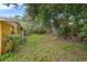 Backyard with mature trees and a portion of house at 7313 S Obrien St, Tampa, FL 33616