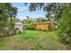 Large backyard with shed and mature trees at 7313 S Obrien St, Tampa, FL 33616