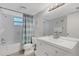 Clean bathroom with white subway tile, vanity, and bathtub at 14462 91St Ave, Seminole, FL 33776