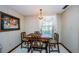 Bright breakfast nook features a wood table and chairs at 2824 Countryside Blvd # 313, Clearwater, FL 33761