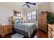 Bedroom with wooden furniture and light green bedding at 6141 Bahia Del Mar Blvd # 232, St Petersburg, FL 33715