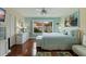 Inviting bedroom with large window, ceiling fan, and walk-in closet at 6141 Bahia Del Mar Blvd # 232, St Petersburg, FL 33715