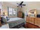 Bedroom with wooden dresser and large window with natural light at 6141 Bahia Del Mar Blvd # 232, St Petersburg, FL 33715