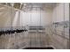 Spacious, empty walk-in closet with built-in shelving at 6141 Bahia Del Mar Blvd # 232, St Petersburg, FL 33715