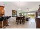 Open dining area adjacent to the living room with golf course views at 6141 Bahia Del Mar Blvd # 232, St Petersburg, FL 33715