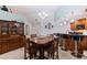 Dining area with wood table and chairs and view of the kitchen at 6141 Bahia Del Mar Blvd # 232, St Petersburg, FL 33715