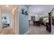 Hallway with light blue walls and tile floor leading to a dining area at 6141 Bahia Del Mar Blvd # 232, St Petersburg, FL 33715