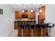 Updated kitchen with wood cabinetry, black countertops, and stainless steel appliances at 6141 Bahia Del Mar Blvd # 232, St Petersburg, FL 33715