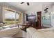 Living area with a large television and sliding doors to the balcony at 6141 Bahia Del Mar Blvd # 232, St Petersburg, FL 33715