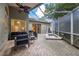 Relaxing screened patio with built-in spa and seating area at 3623 Doral St, Palm Harbor, FL 34685