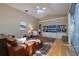 Living room featuring built-in shelving and hardwood floors at 3623 Doral St, Palm Harbor, FL 34685