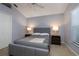 Cozy bedroom with a queen-size bed, nightstands, and ample closet space at 3623 Doral St, Palm Harbor, FL 34685