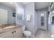 Clean bathroom with granite countertop, shower, and exterior access at 3623 Doral St, Palm Harbor, FL 34685