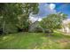 Landscaped backyard with lush greenery at 3623 Doral St, Palm Harbor, FL 34685