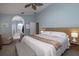 Main bedroom with king bed and ensuite bathroom access at 3623 Doral St, Palm Harbor, FL 34685