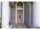 Inviting front door entrance with brick walkway at 3623 Doral St, Palm Harbor, FL 34685