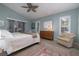 Main bedroom featuring a king bed and an adjacent sitting area at 3623 Doral St, Palm Harbor, FL 34685