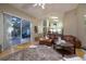 Open living room with view into kitchen and backyard patio at 3623 Doral St, Palm Harbor, FL 34685