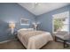 Serene bedroom with a queen bed, nightstands, and a relaxing chair at 3623 Doral St, Palm Harbor, FL 34685
