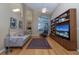 Living room with hardwood floors, comfortable seating and built-in shelving at 3623 Doral St, Palm Harbor, FL 34685