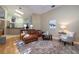 Spacious living room with leather sectional sofa and hardwood floors at 3623 Doral St, Palm Harbor, FL 34685