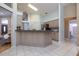 Kitchen with breakfast bar and view into adjacent bathroom at 3623 Doral St, Palm Harbor, FL 34685