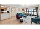 Bright living room with lake view, comfy seating, and modern decor at 750 N Village N Dr # 106, St Petersburg, FL 33716