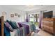 Cozy bedroom with lake view, comfortable bed, and dresser at 750 N Village N Dr # 106, St Petersburg, FL 33716