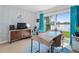 Bright home office features water views, built-in desk, and ample natural light at 750 N Village N Dr # 106, St Petersburg, FL 33716