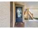 Private condo entry with screen door and nearby stairs at 750 N Village N Dr # 106, St Petersburg, FL 33716