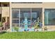 Private patio with lake view and seating area at 750 N Village N Dr # 106, St Petersburg, FL 33716