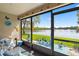 Spacious screened-in porch with lake view at 750 N Village N Dr # 106, St Petersburg, FL 33716