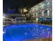 Relaxing nighttime view of the illuminated pool at 10650 Gulf Blvd # 340, Treasure Island, FL 33706