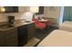 Small condo kitchenette with microwave, stovetop and mini-fridge at 10650 Gulf Blvd # 340, Treasure Island, FL 33706