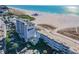 Aerial view of beachfront hotel and parking at 10650 Gulf Blvd # 340, Treasure Island, FL 33706