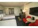 Condo living room with two beds, kitchenette, and TV at 10650 Gulf Blvd # 340, Treasure Island, FL 33706
