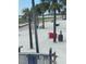 Beach area with lounge chairs and palm trees at 10650 Gulf Blvd # 340, Treasure Island, FL 33706