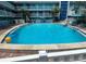 Inviting outdoor pool with lounge chairs at 10650 Gulf Blvd # 340, Treasure Island, FL 33706