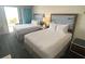 Two beds in a condo bedroom with ocean view at 10650 Gulf Blvd # 340, Treasure Island, FL 33706