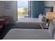 Two beds in a condo bedroom with ocean view at 10650 Gulf Blvd # 340, Treasure Island, FL 33706