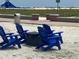 Blue chairs and fire pit near beach access at 10650 Gulf Blvd # 340, Treasure Island, FL 33706