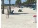Relaxing beach area with lounge chairs and palm trees at 10650 Gulf Blvd # 340, Treasure Island, FL 33706