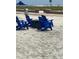 Beachfront seating area with fire pit and chairs at 10650 Gulf Blvd # 340, Treasure Island, FL 33706