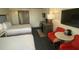 Condo living room with two beds, kitchenette, and TV at 10650 Gulf Blvd # 340, Treasure Island, FL 33706