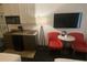 Condo kitchenette with microwave, stovetop, and mini-fridge at 10650 Gulf Blvd # 340, Treasure Island, FL 33706