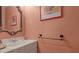 Small bathroom with single sink vanity and decorative mirror at 2700 Bayshore Blvd # 2C/578, Dunedin, FL 34698